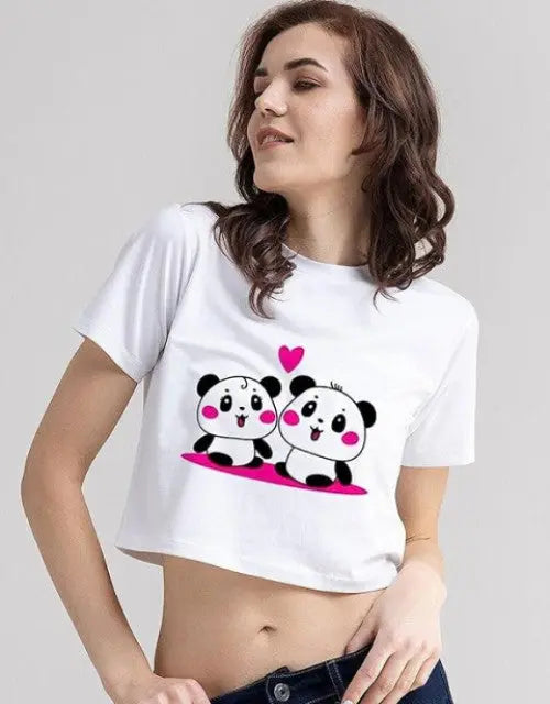 Woman wearing a white t-shirt with cartoon panda design on a plain background

