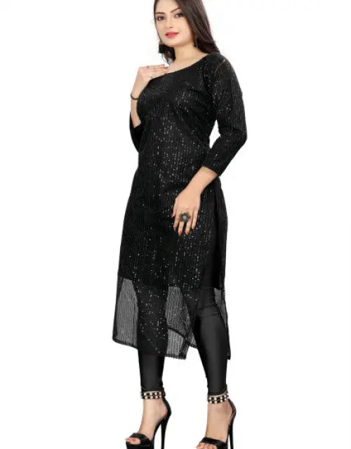 Woman wearing a black sequin dress on a white background