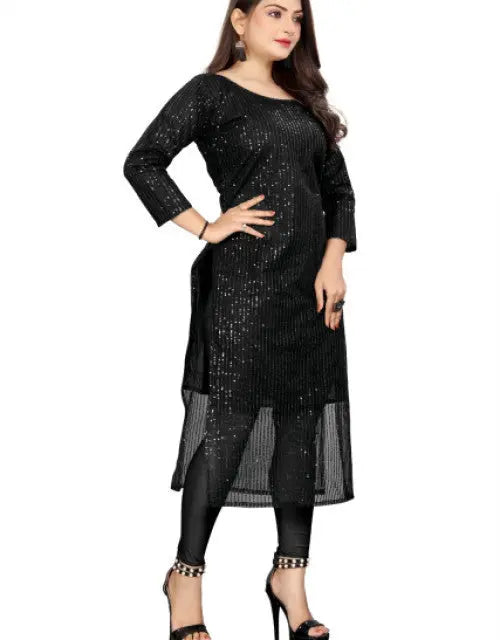 Woman wearing a black sequined dress on a white background