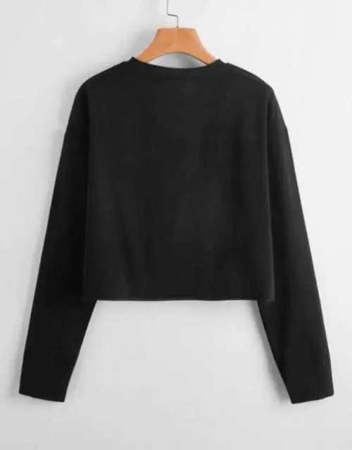 Black sweater on a wooden hanger against a white background

