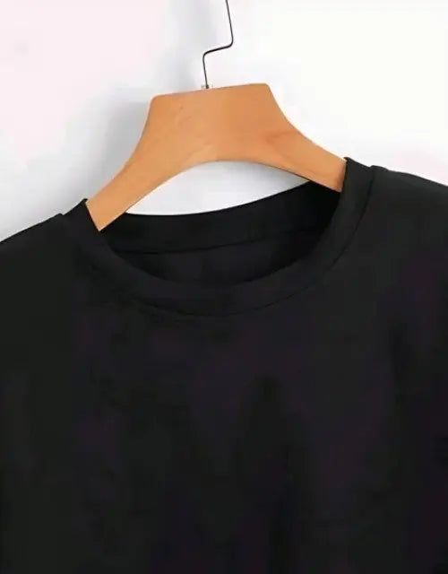 Black shirt on a wooden hanger against a white background

