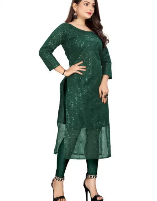 Woman wearing a green dress with a white background