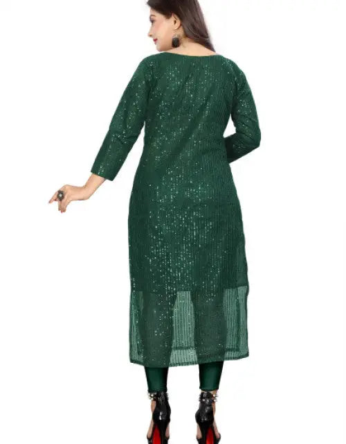Woman wearing a green dress with a white background