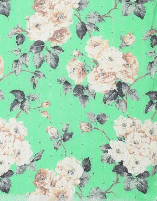 Floral pattern with white and beige flowers on a green background