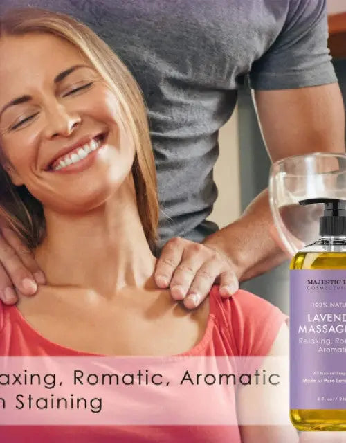 Woman receiving a massage with a bottle of lavender massage oil in the foreground.