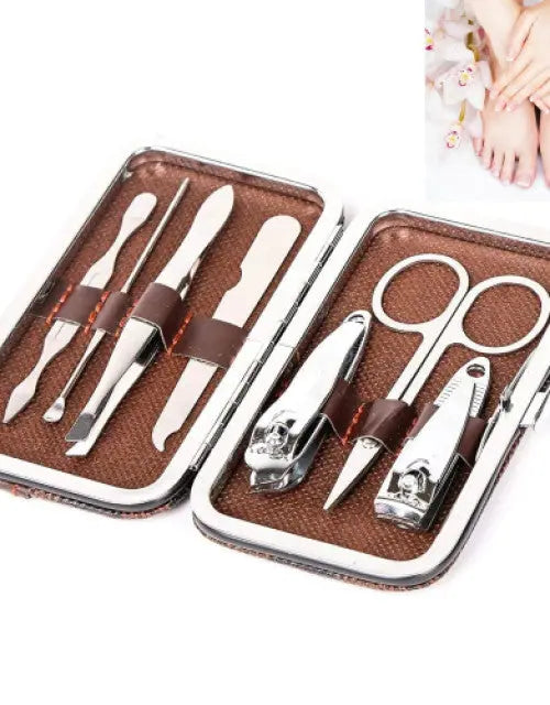 Manicure set with tools in a brown case on a white background