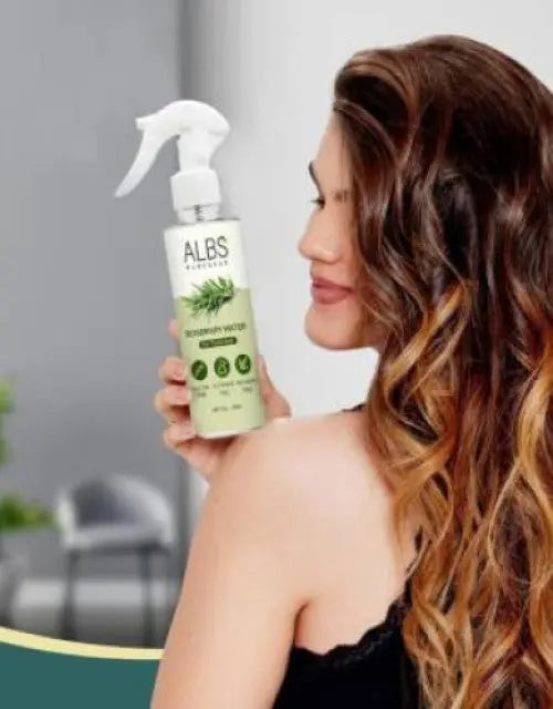 Woman holding an ALBS product with a blurred indoor background