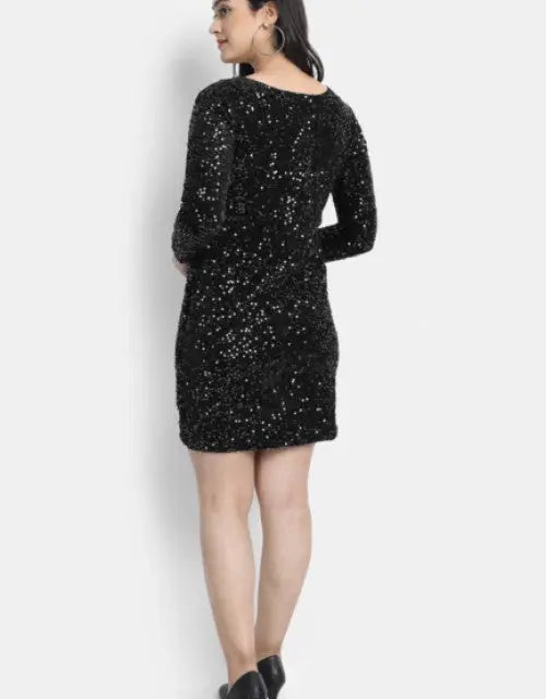 Black sequin dress worn by a person on a white background