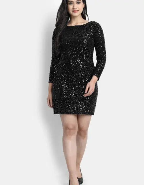 Woman wearing a black sequin dress on a white background