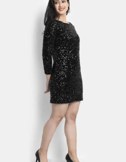 Woman wearing a black sequin dress on a white background