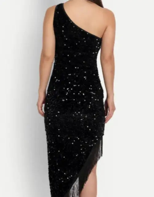 Black one-shoulder dress with sequins and fringe on a white background