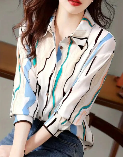 Person wearing a patterned shirt with a blurred background