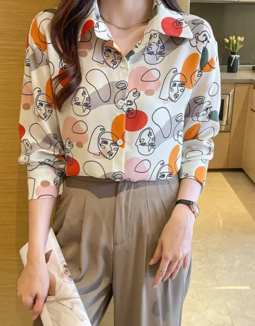 Person wearing a colorful patterned shirt in a kitchen setting