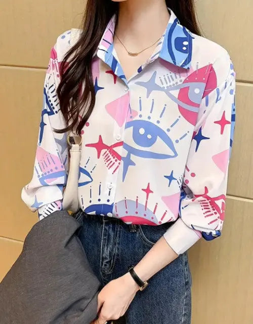Person wearing a colorful patterned shirt with a neutral background