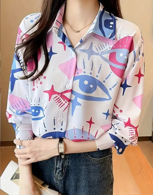 Person wearing a colorful patterned shirt with a neutral background